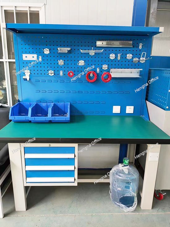 Top Industrial Workbench with Triple Drawers and Dual Pegboards for Efficient Factory Tool Organization